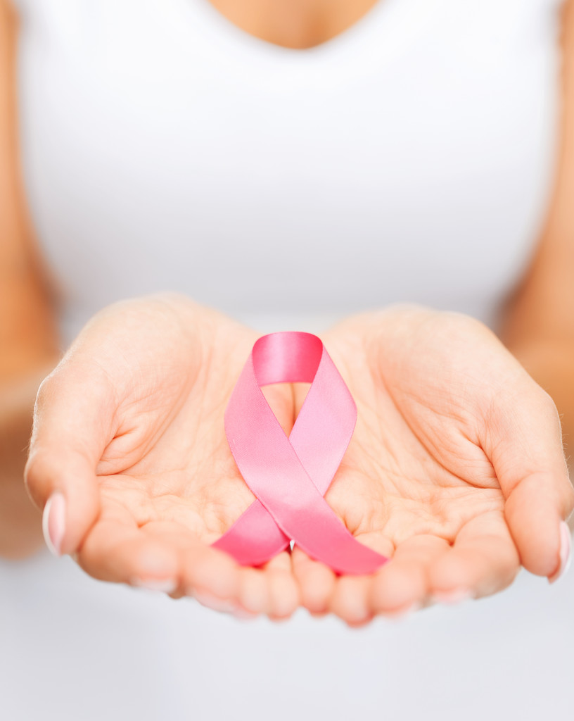 Hands holding pink breast cancer awareness ribbon - Photo, Image