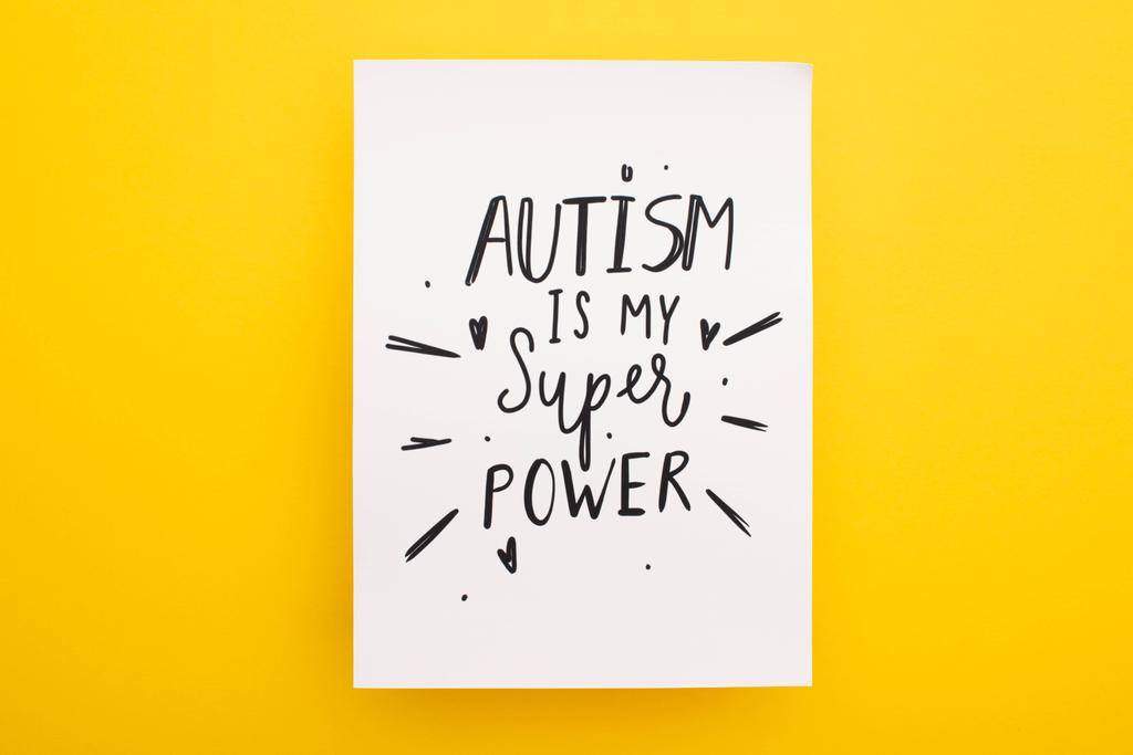top view of sheet of paper with autism is my super power inscription on yellow - Photo, Image