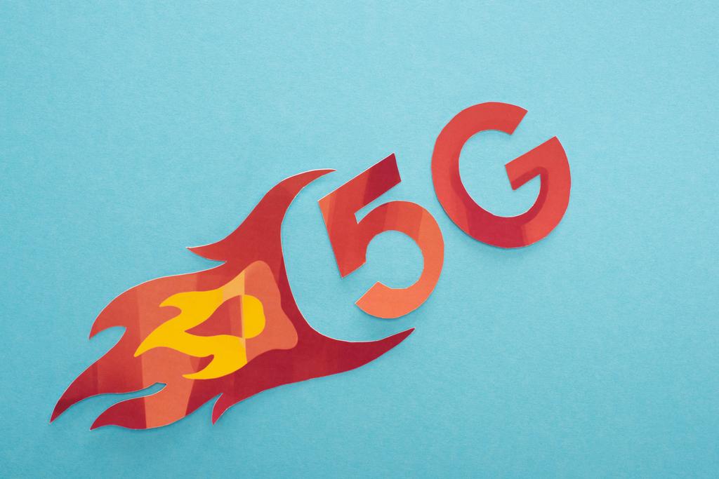 top view of red 5g with flame lettering on blue background - Photo, Image