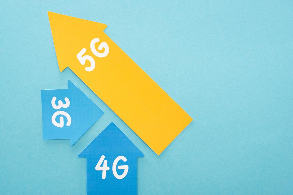 top view of 3g, 4g and 5g arrows on blue background - Photo, Image
