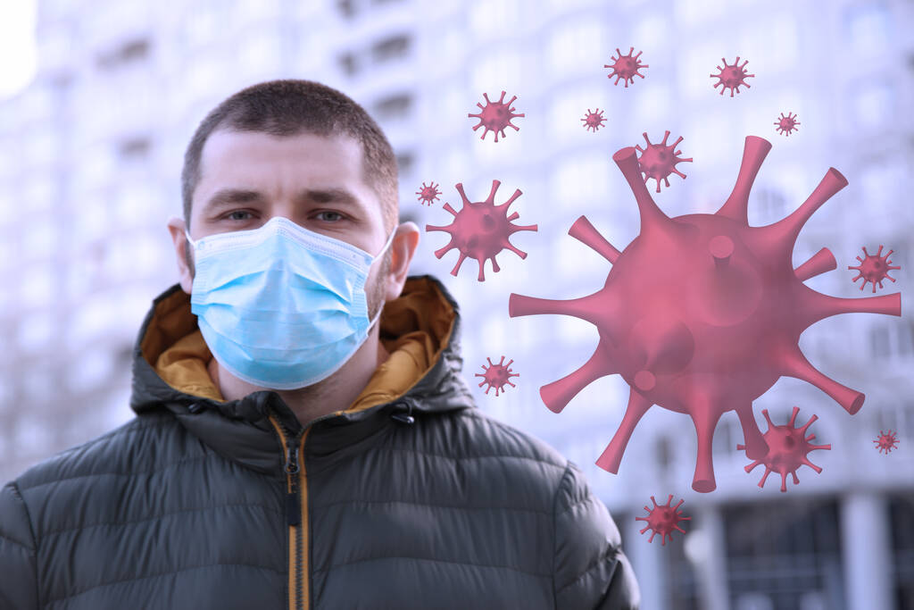 Hombre con máscara médica al aire libre durante el brote de coronavirus
 - Foto, imagen