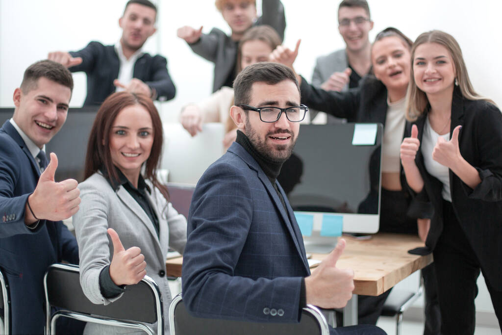 group of young professionals showing thumbs up - Photo, Image