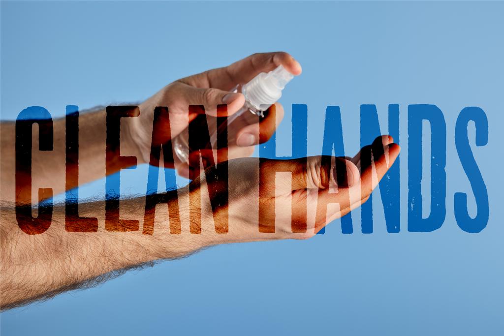 cropped view of man using hand sanitizer in spray bottle isolated on blue, clean hands illustration - Photo, Image