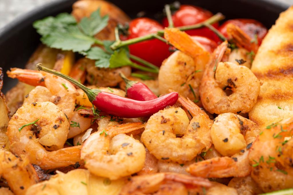 close up view of fried shrimps with grilled bread, tomatoes, chili peppers - Photo, Image