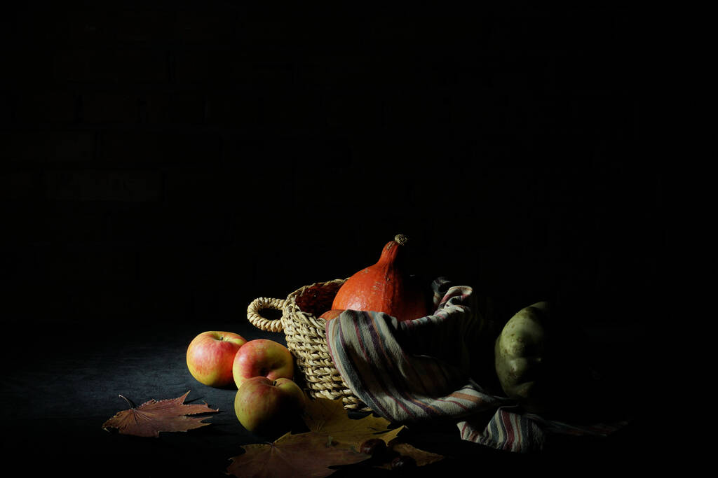 autumn still life in a dark key with pumpkin and apples - Photo, Image