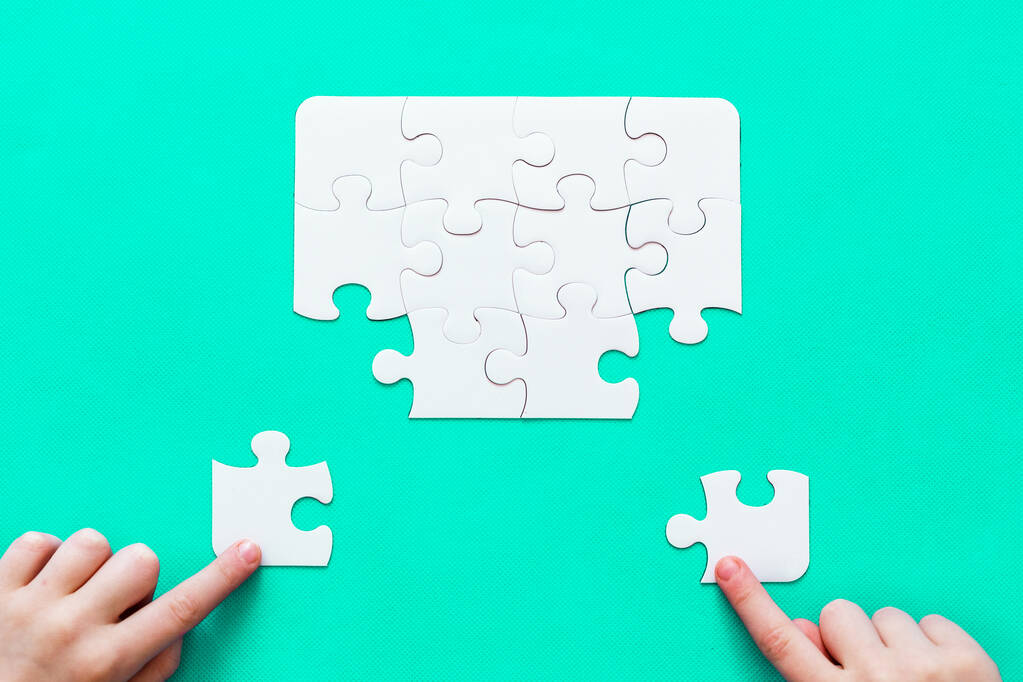 Jigsaw Puzzle with missing piece on mint background Top view People hand - Photo, Image