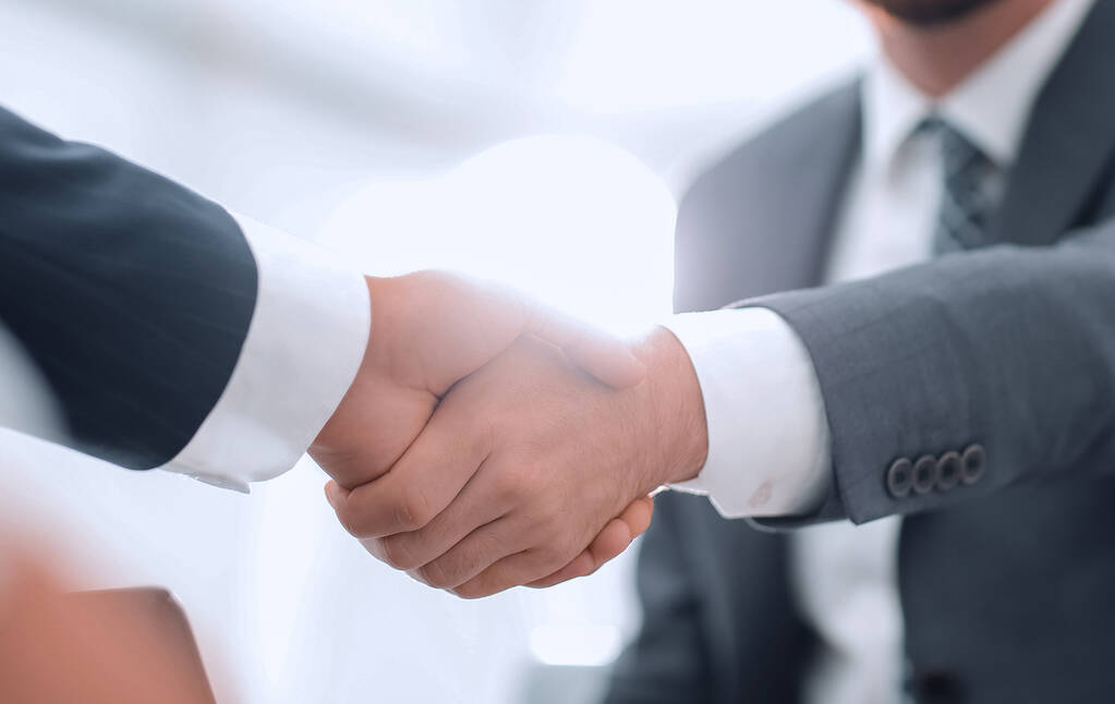 Two colleagues shaking hands after a business meeting - Photo, Image