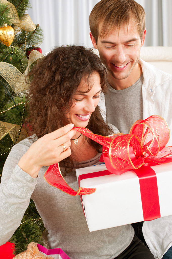 Christmas Gift. Happy Couple with Christmas and New Year Gift at - Photo, Image