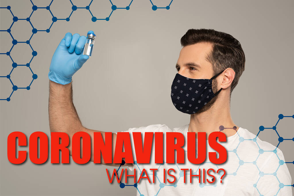 Man in safety mask holding jar of vaccine isolated on grey, coronavirus what is this illustration  - Photo, Image