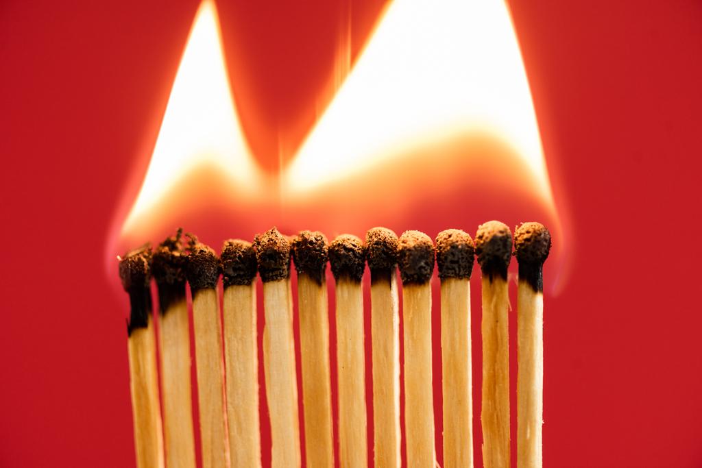 Matches with fire on red background - Photo, Image