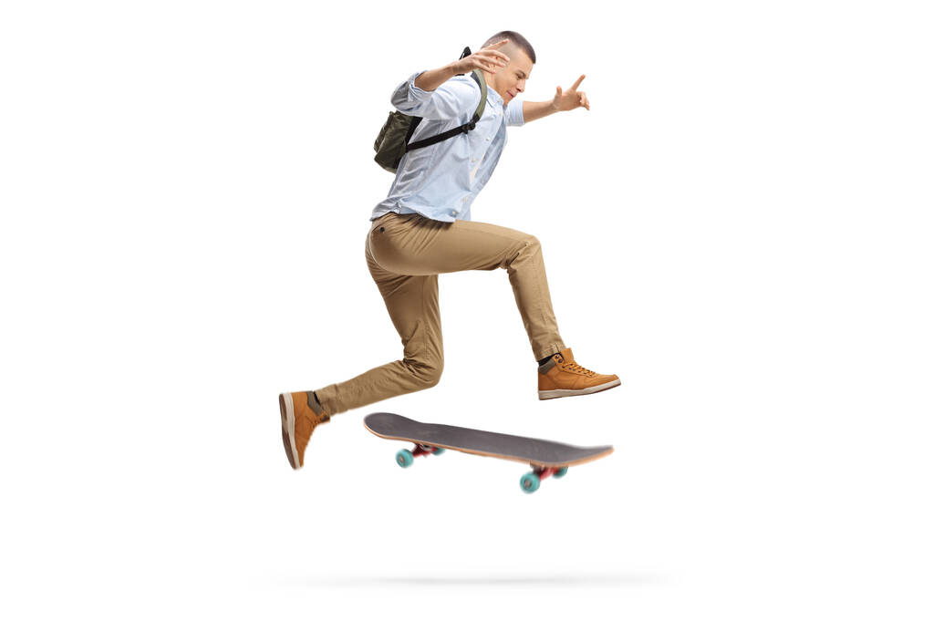 Чоловік студент стрибає зі скейтбордом ізольовано на білому тлі
 - Фото, зображення
