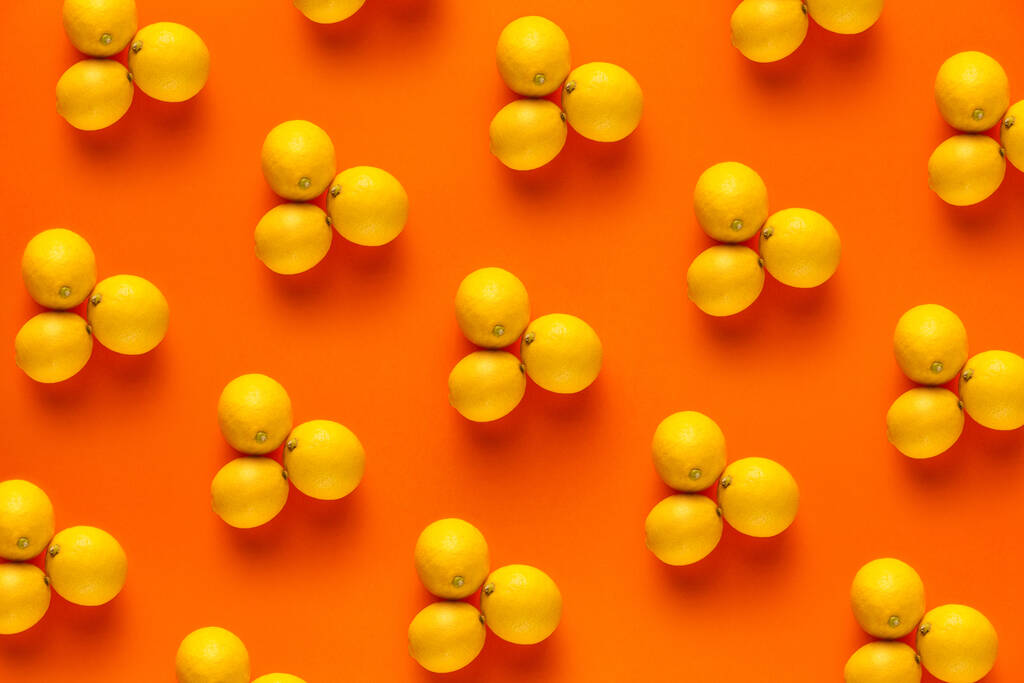 Zitronen-Vitamin-Muster auf orangefarbenem Hintergrund - Foto, Bild