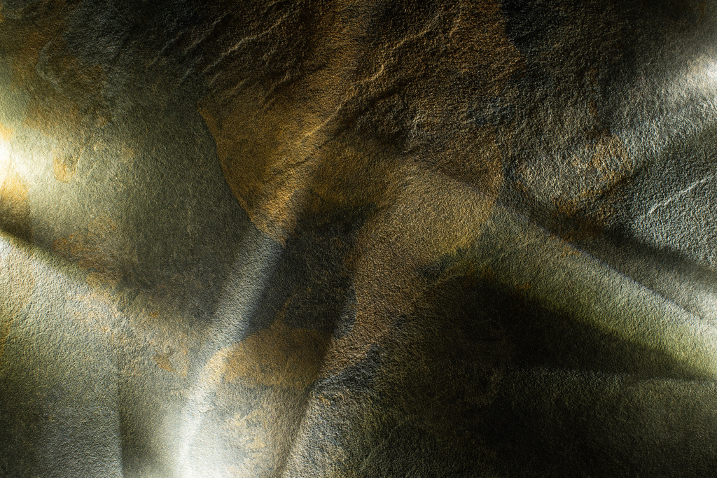 light prism with beams on dark stone texture background - Photo, Image