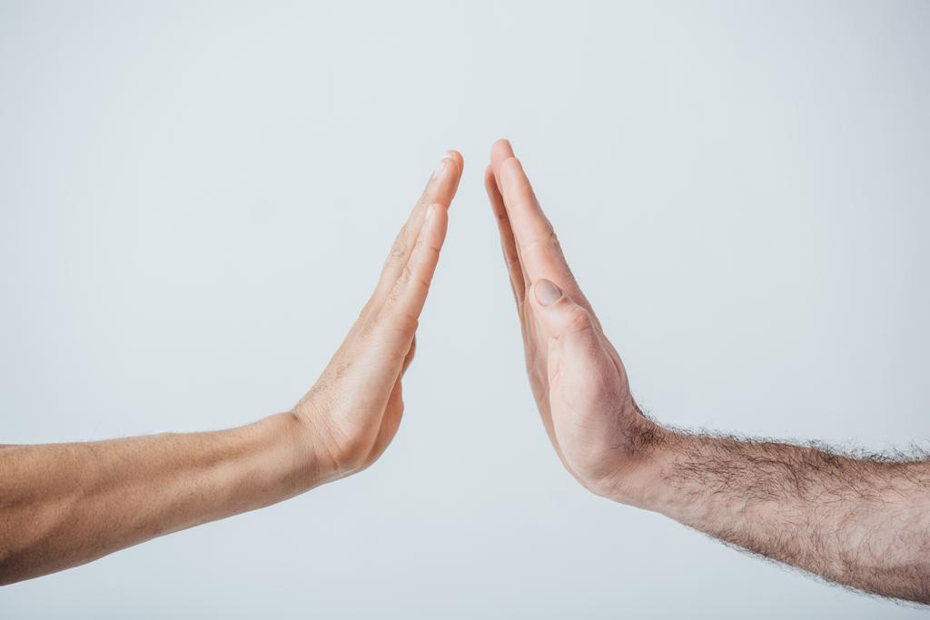 Cropped view of men doing high five isolated on grey - Photo, Image