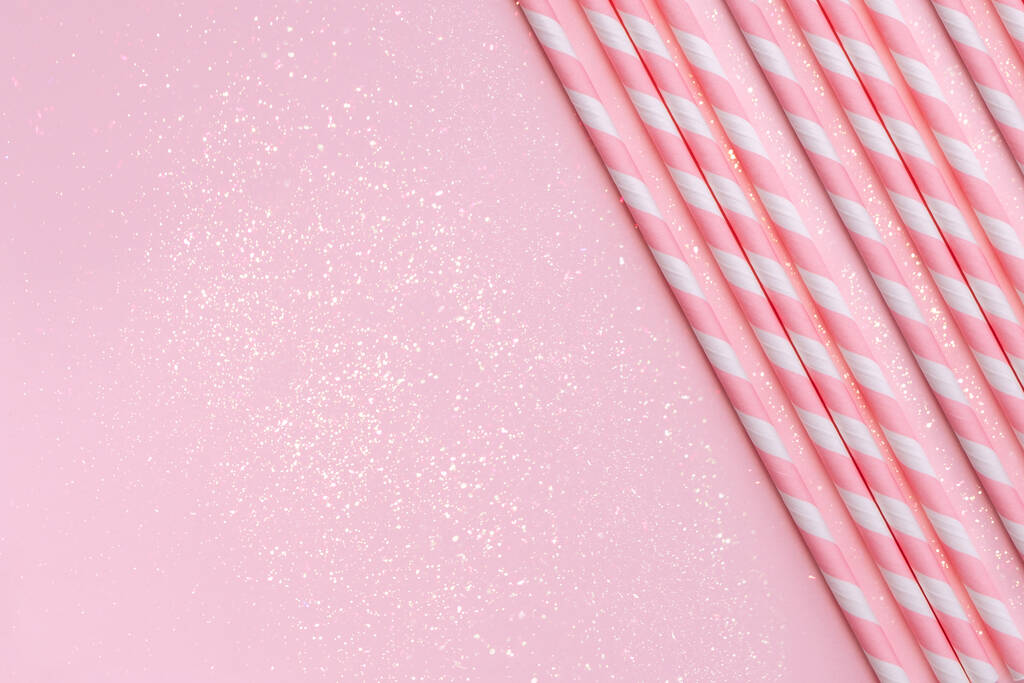 Paper straws on background with sparkles - Photo, Image