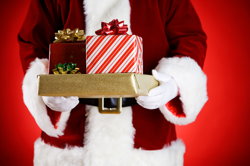 Weihnachtsmann: Hände voll Weihnachtsgeschenke - Foto, Bild