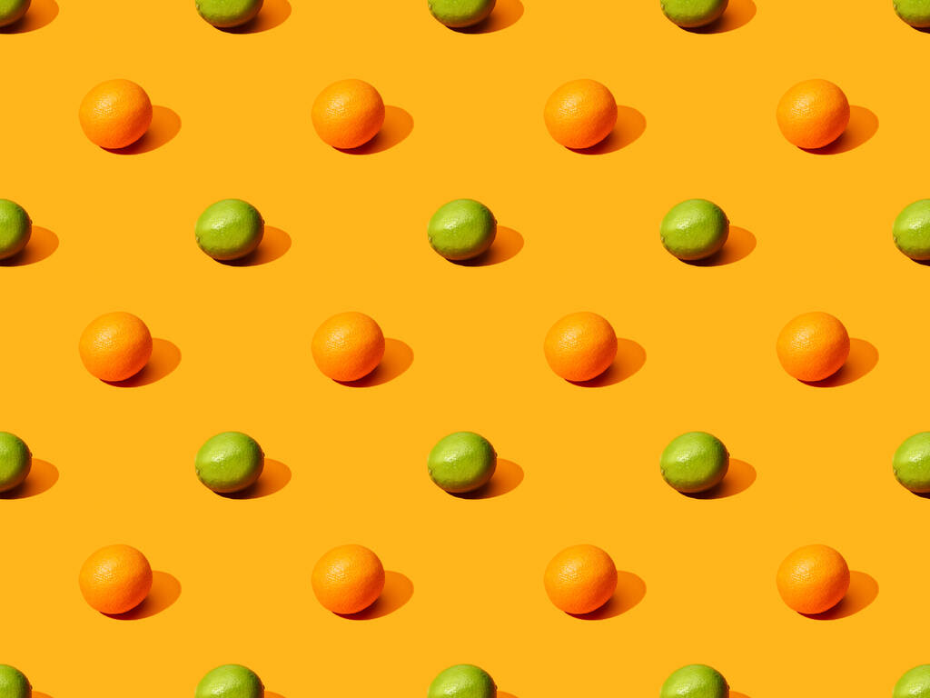 kypsiä appelsiineja ja limettejä värikkäällä pohjalla, saumaton kuvio
 - Valokuva, kuva