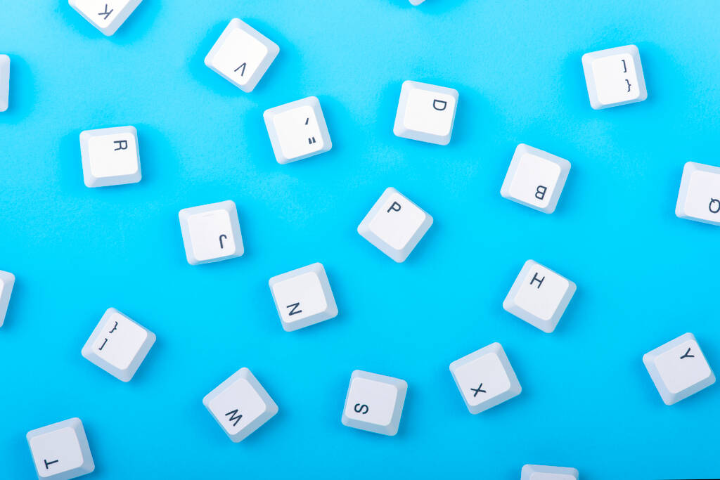 Keyboard keys isolated. White keyboard keys on blue background. Top view. Close up - Photo, Image
