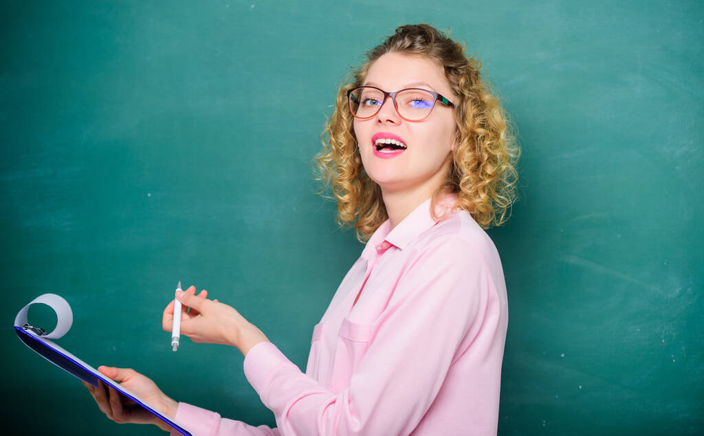 Preparing to exams. happy student in glasses at blackboard. girl teacher at school lesson. report project. back to school. teacher with document folder. new school year. Girl prepare for exams - Photo, Image
