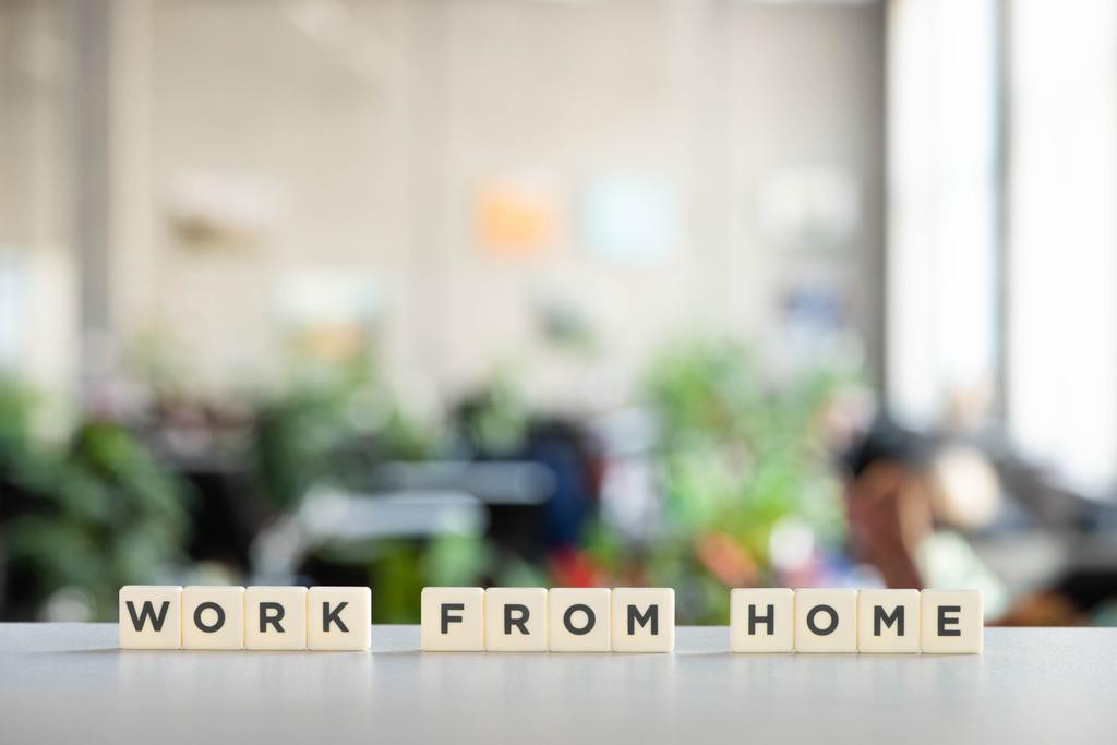 white cubes with work from home lettering on white desk  - Photo, Image