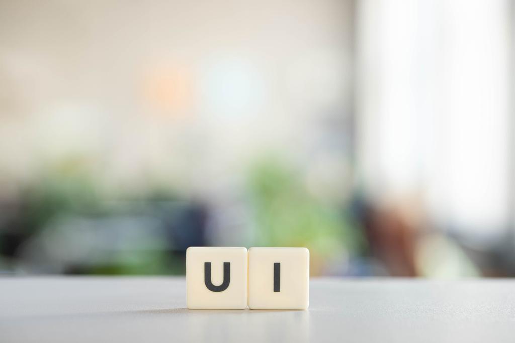 white cubes with ui lettering on office desk  - Photo, Image