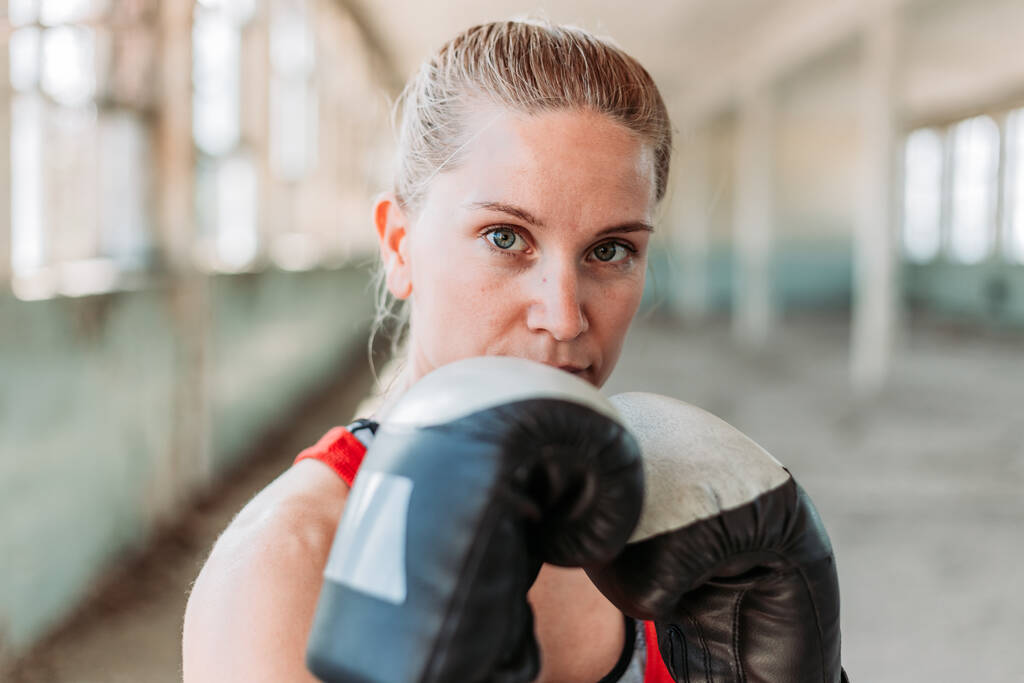 Portrait of young, fit female boxer. Sport, active lifestyle - Photo, Image