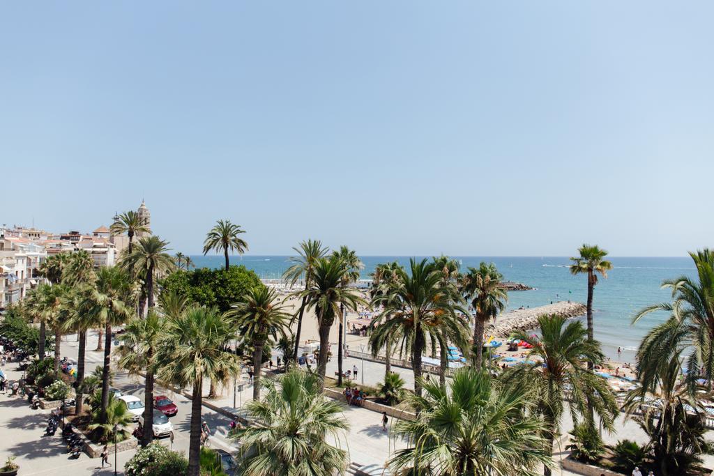 Urban street with palm trees on sea coast in Catalonia, Spain  - Photo, Image