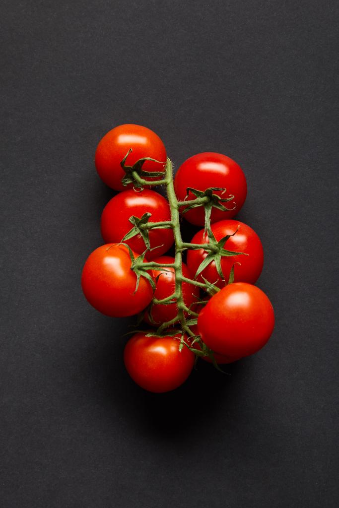 top view of ripe and fresh cherry tomatoes on black - Photo, Image