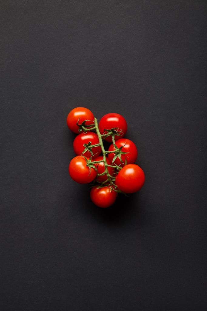 top view of organic and fresh cherry tomatoes on black - Photo, Image