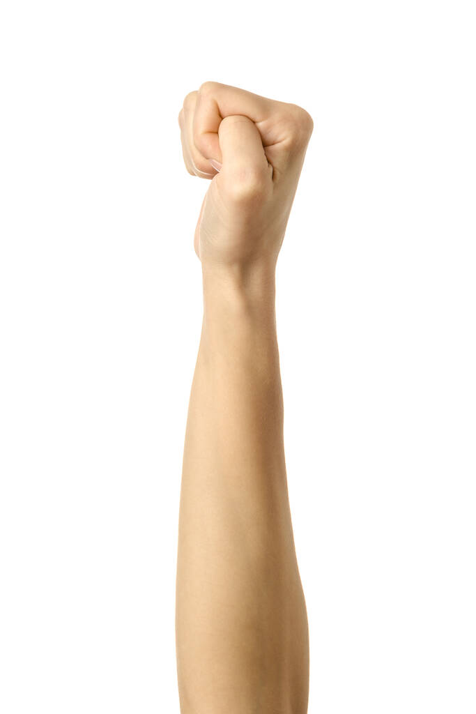 Mano apretada en un puño. Imagen vertical. Mano de mujer con gesto de manicura francesa aislada sobre fondo blanco. Parte de la serie - Foto, Imagen