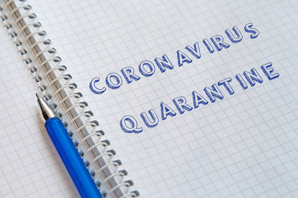 Lettering Coronavirus cuarentena en hoja de cuaderno
 - Foto, imagen