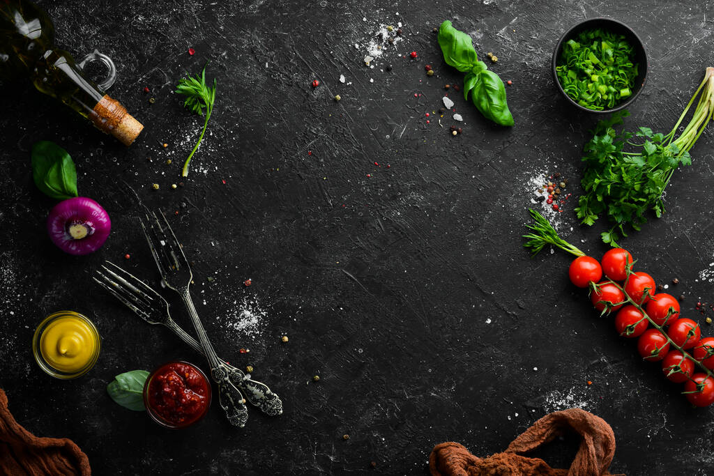 Food background. Vegetables, spices and kitchen utensils on the old table. Free copy space. - Photo, Image