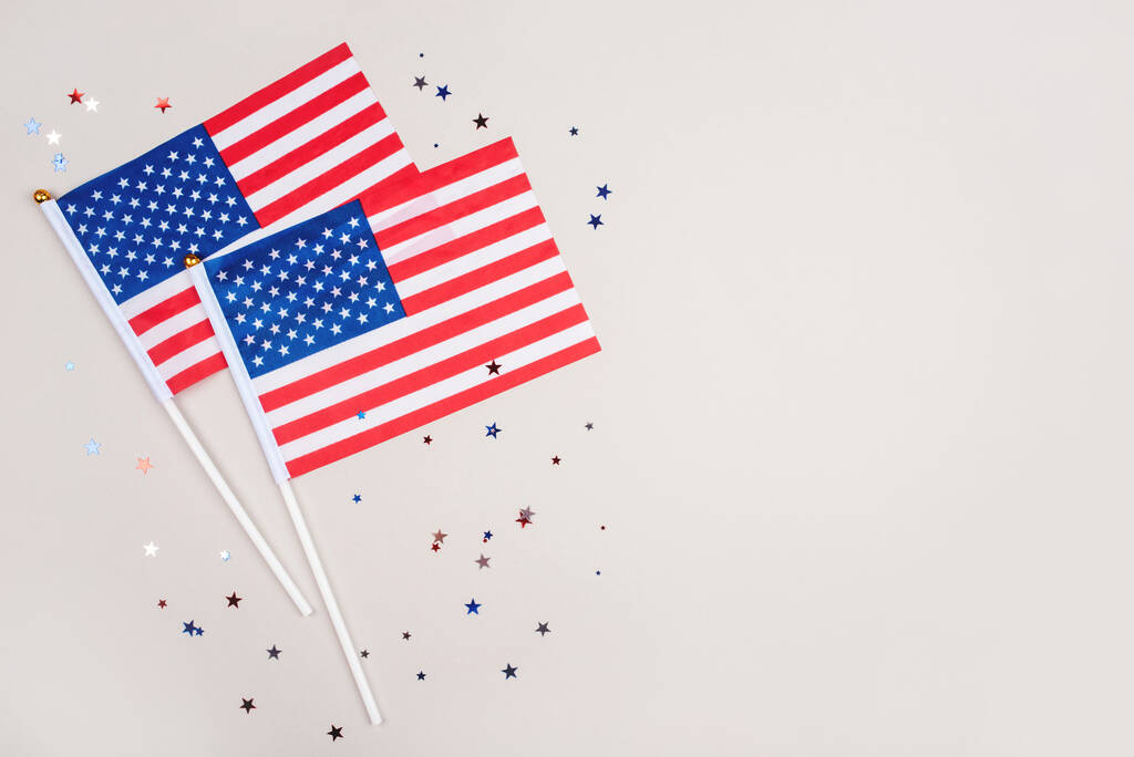 Festive background with US flags and confetti. - Photo, Image