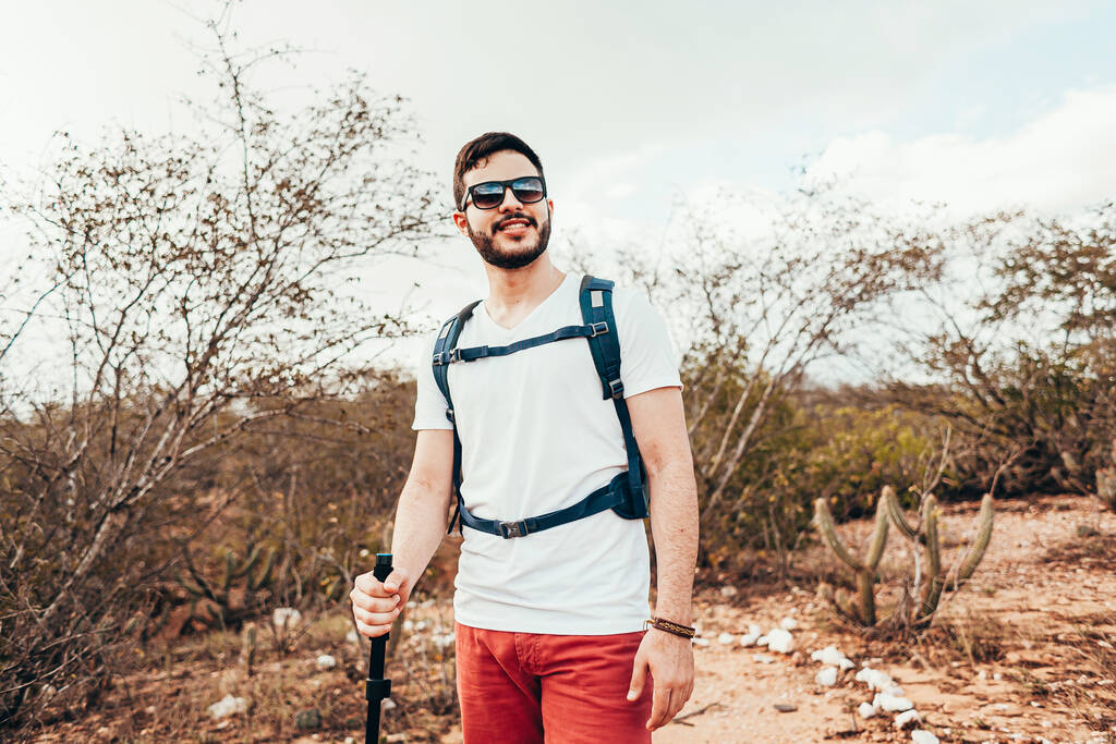 Young backpacker hiking in a semi-arid region of Brazil known as Caatinga - Photo, Image