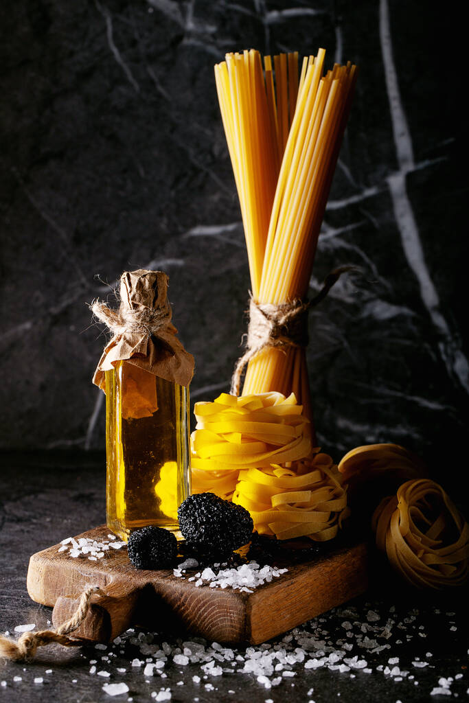 Home made egg pasta served with truffles, truffle infused oil and salt. New concept of raw foods. - Photo, Image