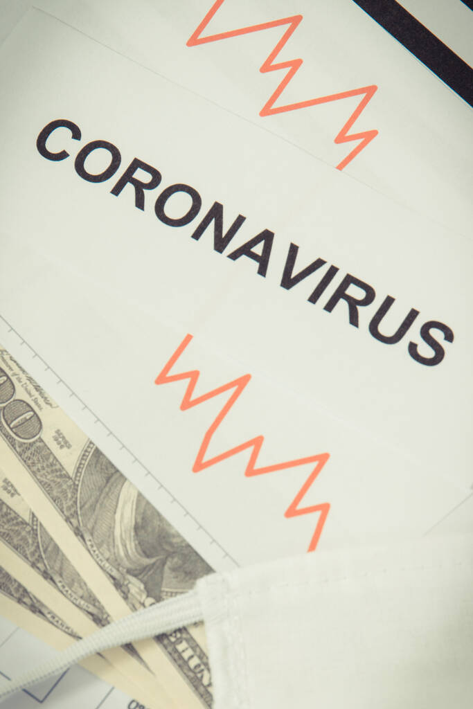 Επιγραφή coronavirus, δολάριο νομίσματα και φθίνουσα γράφημα ως κίνδυνο της παγκόσμιας οικονομικής κρίσης που προκαλείται από τον ιό. Covid-19 - Φωτογραφία, εικόνα