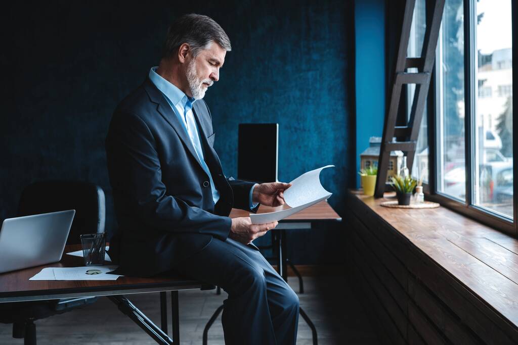 Confident pensive mature business man in modern office. - Photo, Image