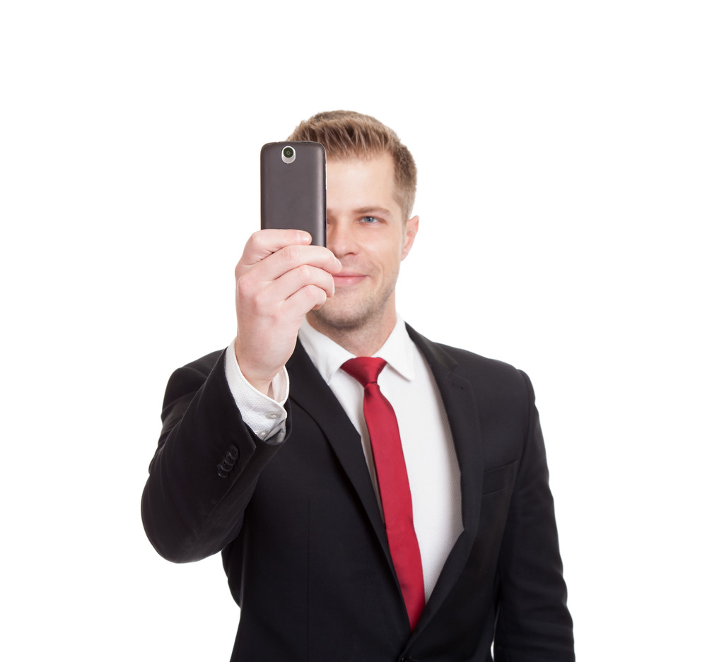 Bello uomo d'affari che si fa un selfie
 - Foto, immagini