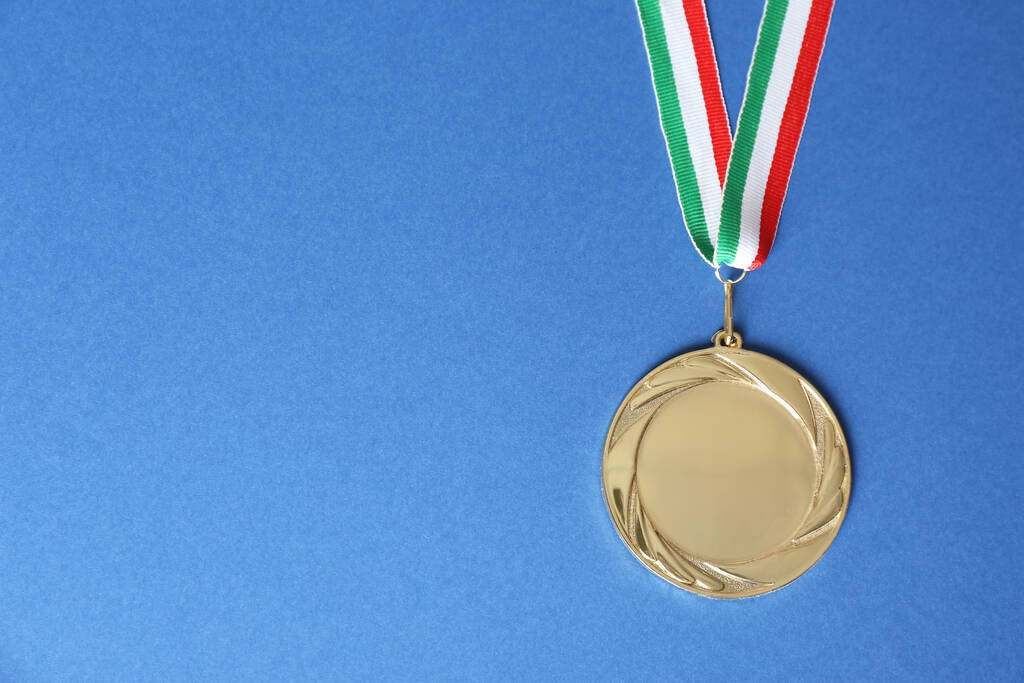 Gold medal on blue background, top view. Space for design - Photo, Image