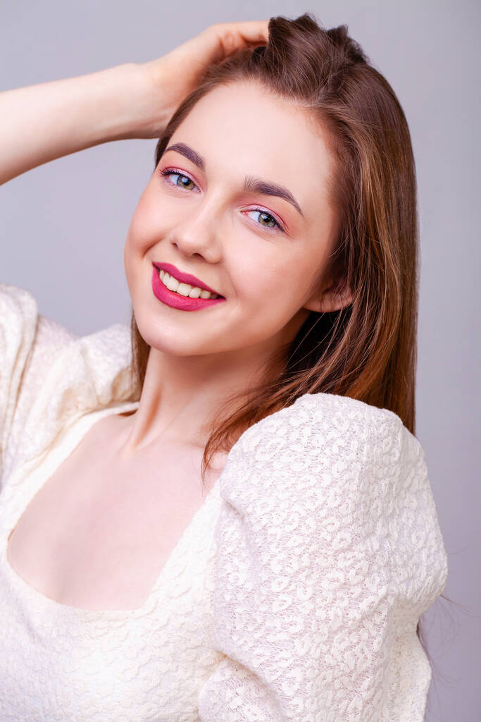 Make up beauty female face. Close up portrait of a young beautiful brunette model, isolated on white background - Valokuva, kuva