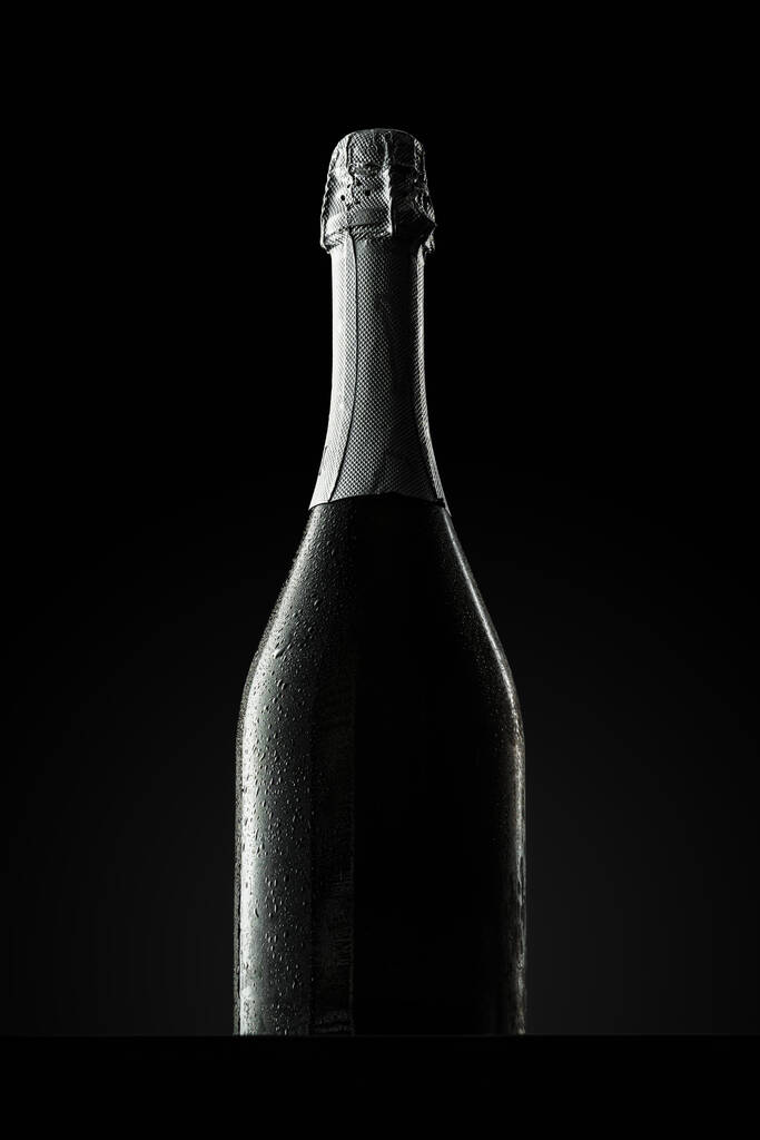 Champagne bottle on black background, copy space - Photo, Image