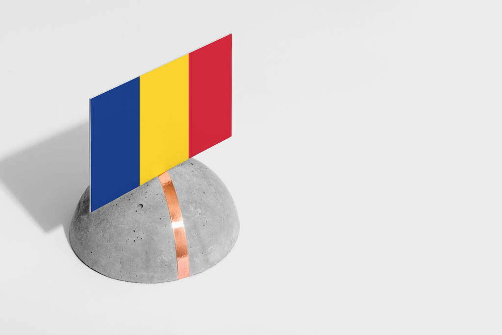 Romania flag tagged on rounded stone. White isolated background. Side view minimal national concept. - Photo, Image