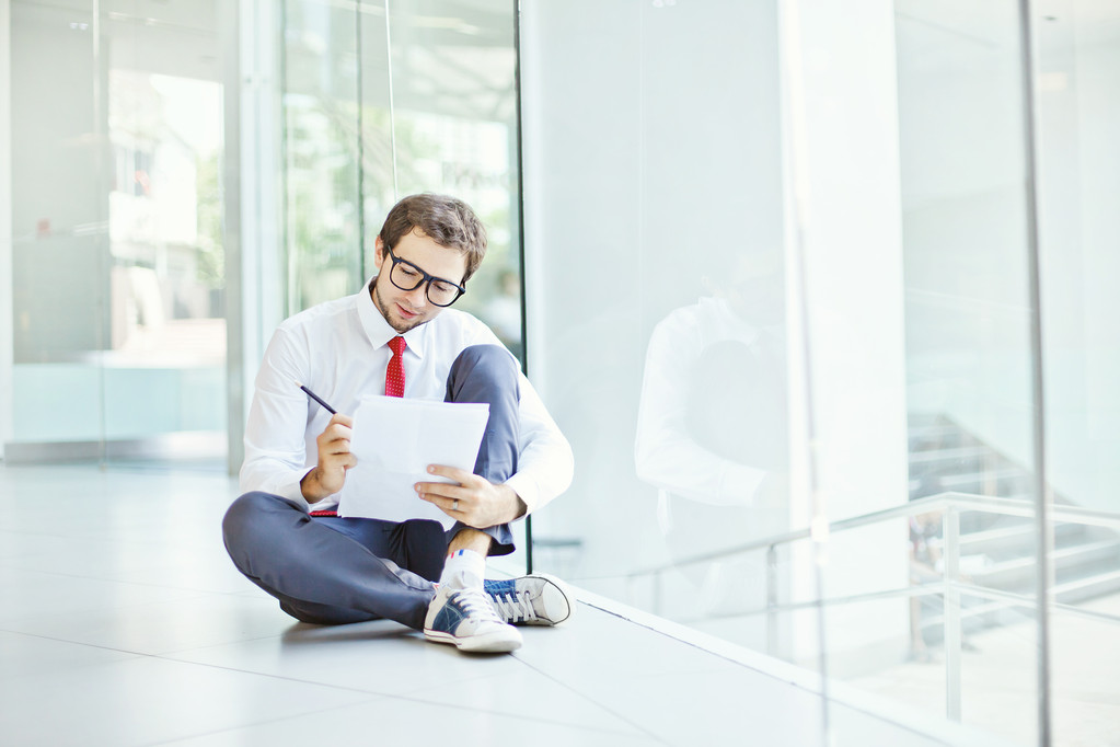Businessman or student sitting on a floor - Photo, Image