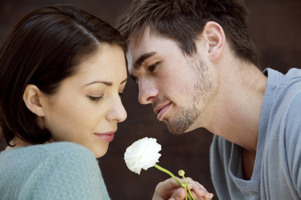 Couple with white rose in between - Photo, Image