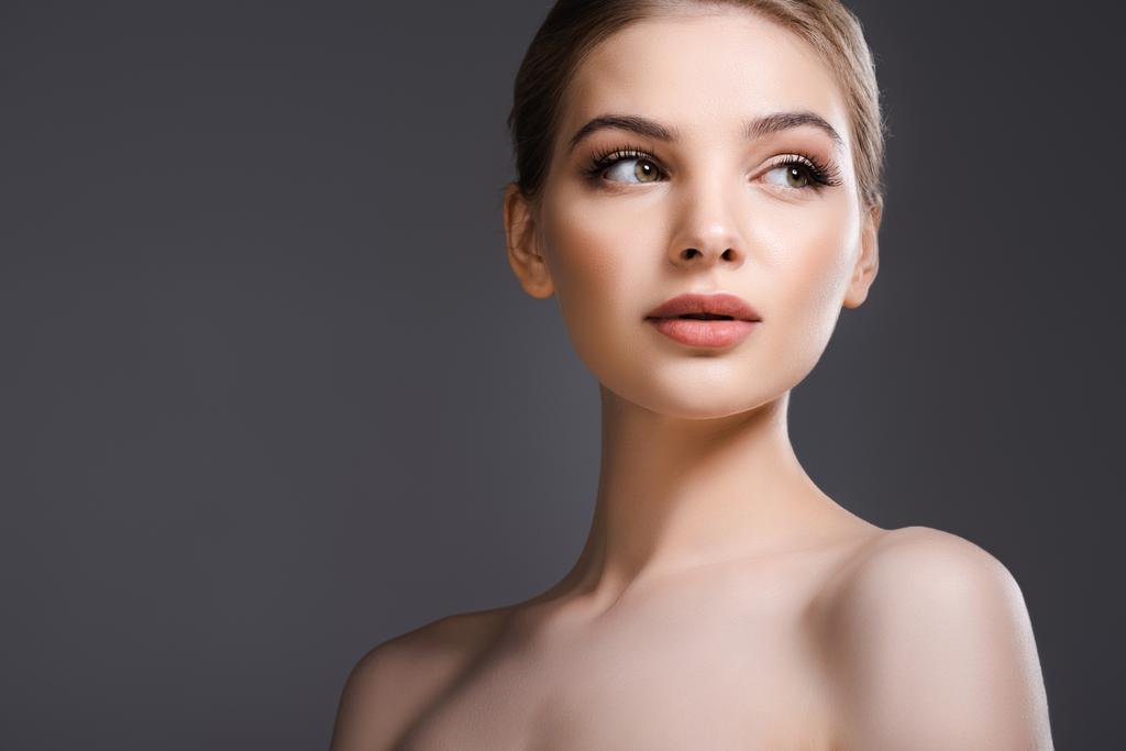 beautiful and naked woman with makeup looking away isolated on grey  - Photo, Image