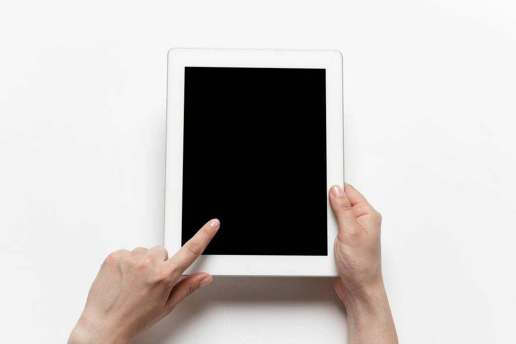 Close up of human hand using tablet with blank black screen, education and business concept - Photo, Image