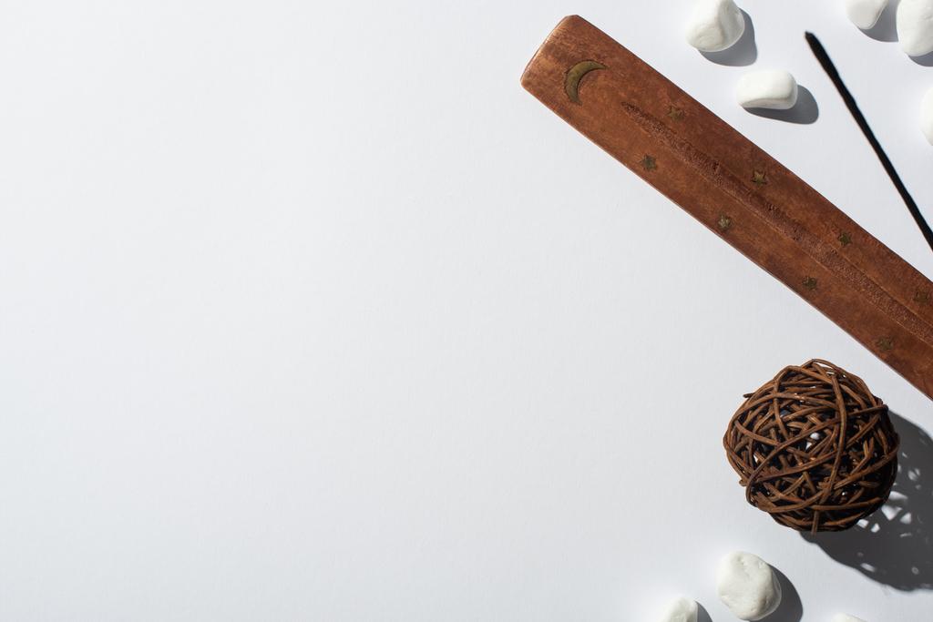 top view of aroma stick, stones, wooden stand and decorative ball on white background - Photo, Image