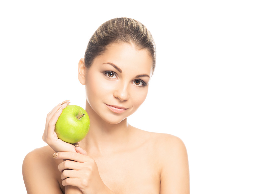 Portrait d'une jeune femme nue tenant une pomme
 - Photo, image