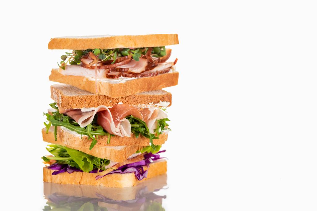 fresh sandwiches with arugula and meat on white surface - Photo, Image