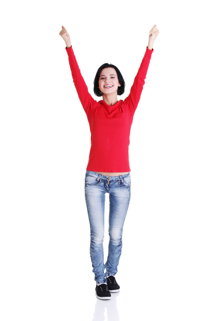 Mujer joven emocionada con los puños en alto
 - Foto, Imagen